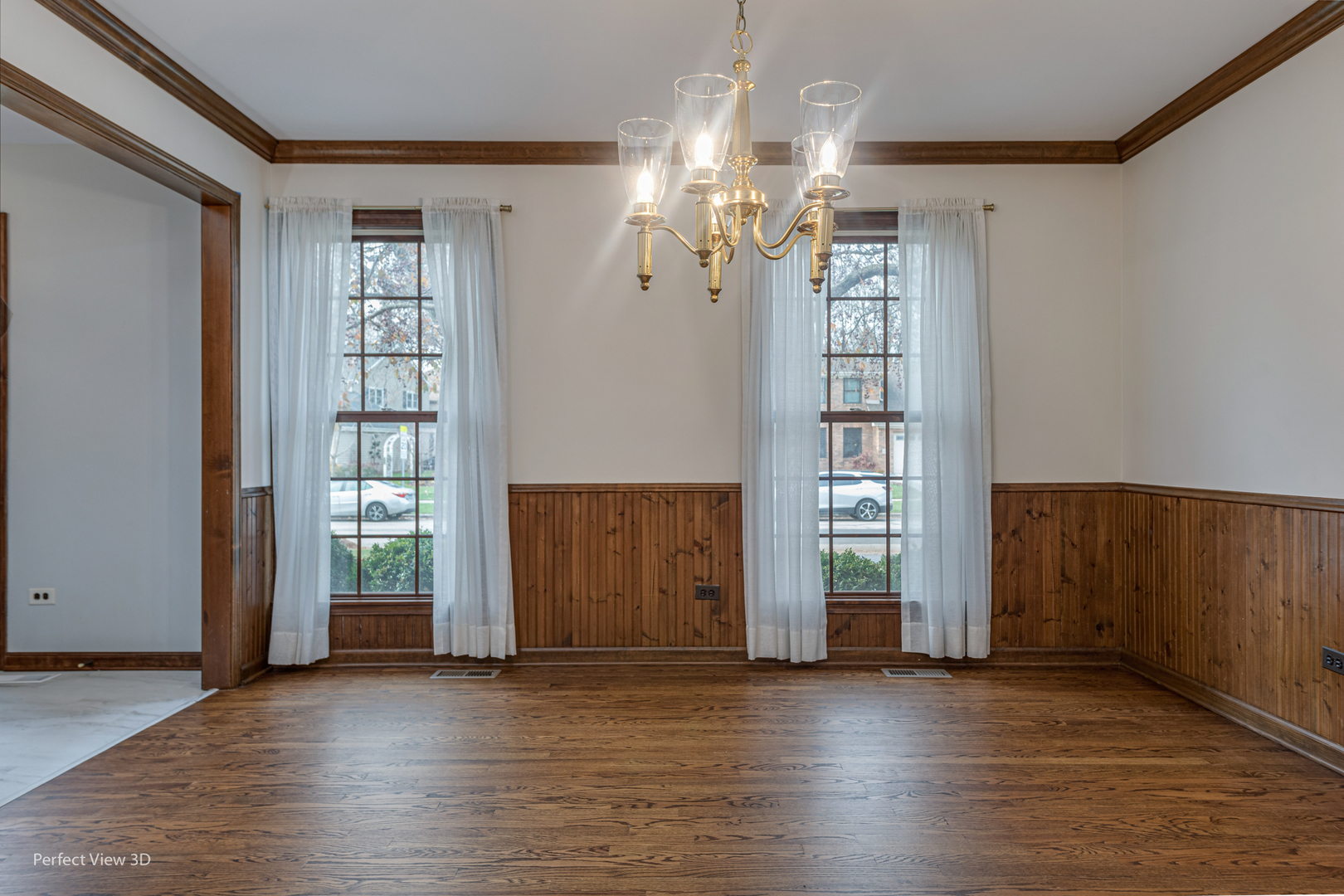 1243 Redfield Road Naperville, IL 60563 - Photo 4 of 45 an empty room with wooden floor cabinet and windows