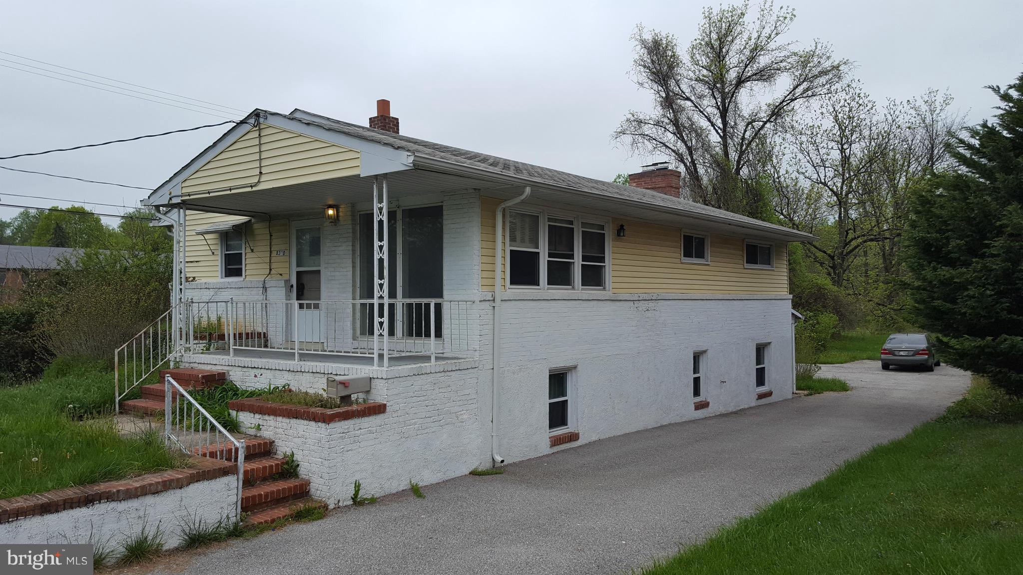 8320 Liberty Road Baltimore, MD 21244 - Photo 1 of 13 front view of a house with a yard