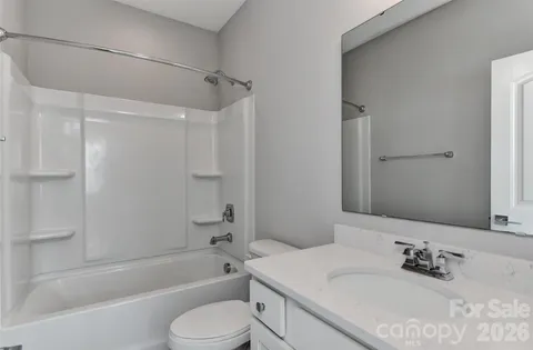 a close view of a utility room with dryer and washer