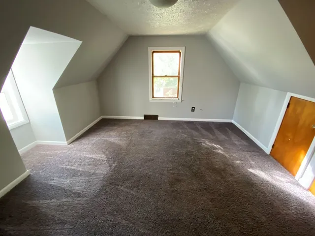 a bathroom with a light fixture and a sink