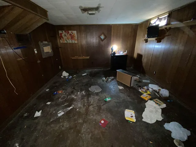 a view of a white house with a large space