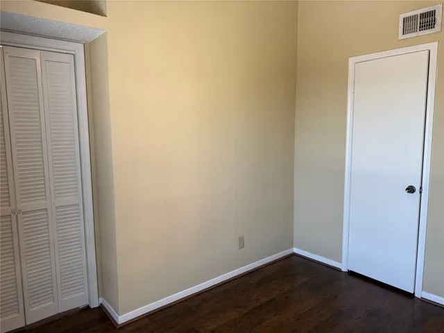 a view of a small space with wooden floor