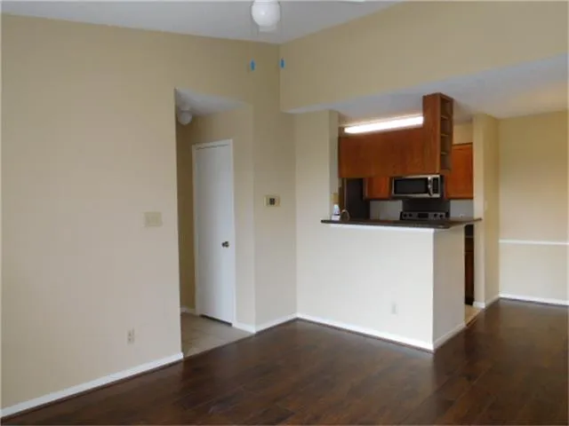 a view of a kitchen from a hallway