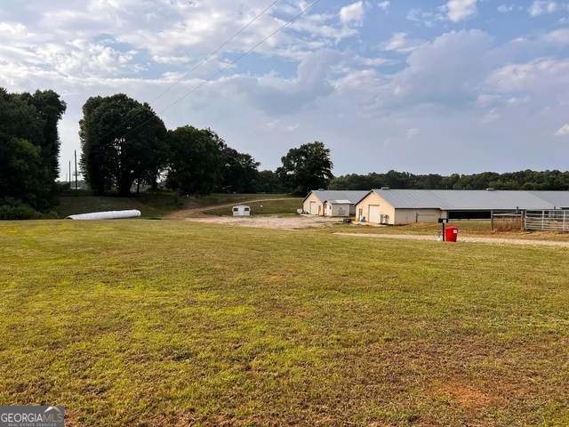 1350 Bakers Road Royston, GA 30662 - Photo 11 of 35 a view of a lake with houses in the back