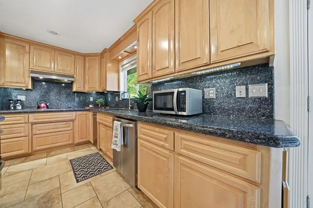 a spacious bedroom with a bed and window