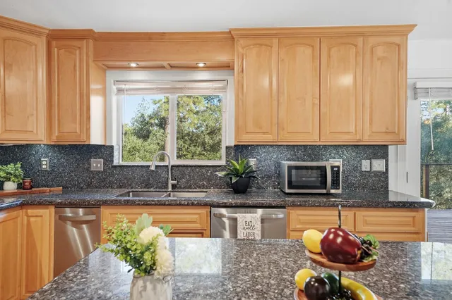 a view of balcony with wooden floor and seating space