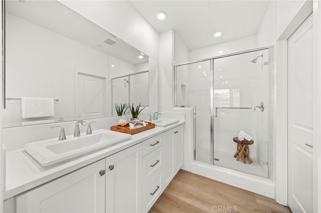 1533 St Simon Circle, Unit B Alhambra, CA 91803 - Photo 13 of 27 a bathroom with a double vanity sink mirror and shower