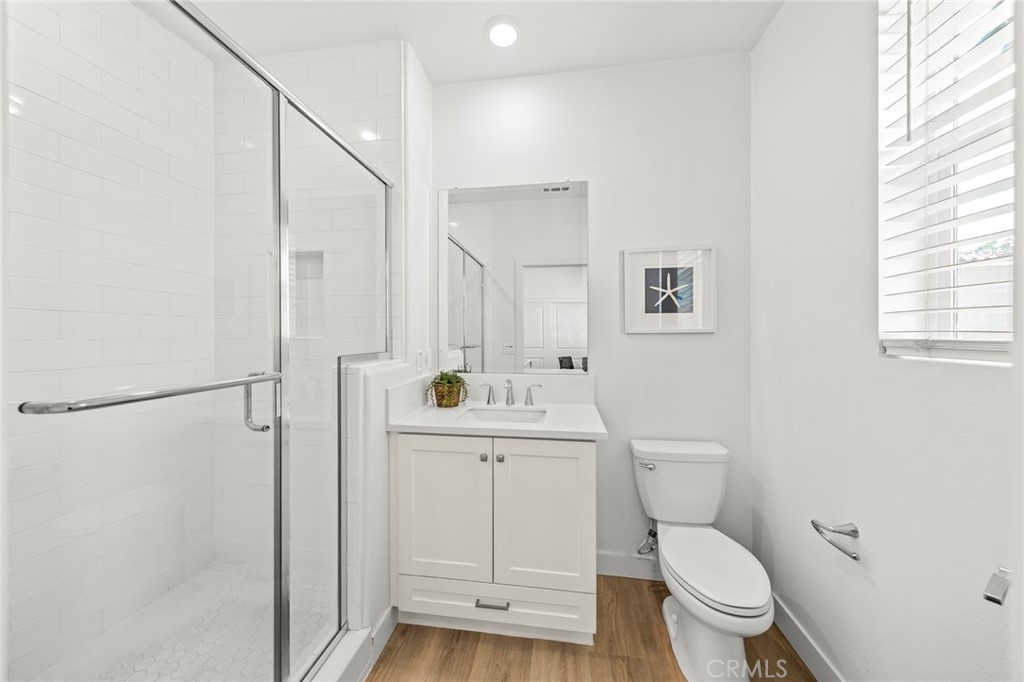 1533 St Simon Circle, Unit B Alhambra, CA 91803 - Photo 15 of 27 a bathroom with a toilet a sink and a window