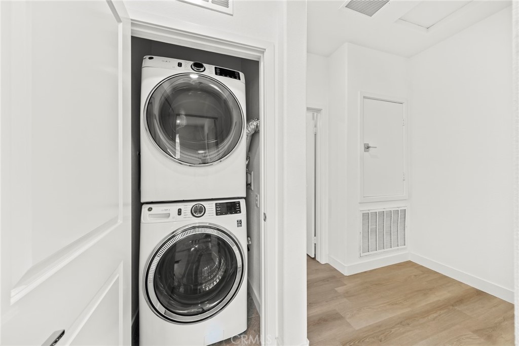 1533 St Simon Circle, Unit B Alhambra, CA 91803 - Photo 18 of 27 a view of a hallway with washer and dryer