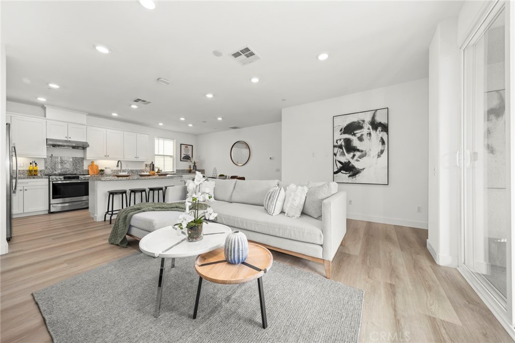 1533 St Simon Circle, Unit B Alhambra, CA 91803 - Photo 7 of 27 a living room with furniture and kitchen view