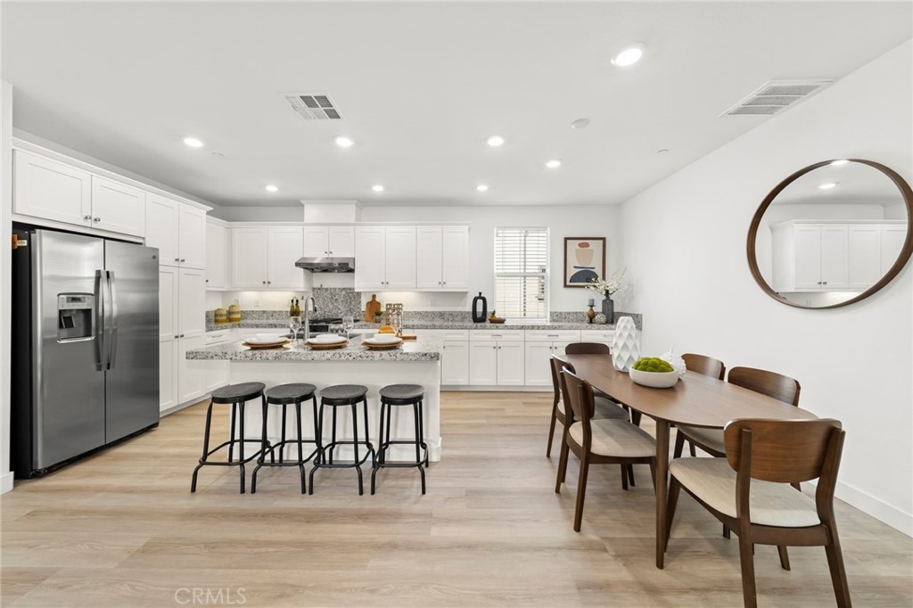 1533 St Simon Circle, Unit B Alhambra, CA 91803 - Photo 8 of 27 a kitchen with a dining table chairs and view kitchen