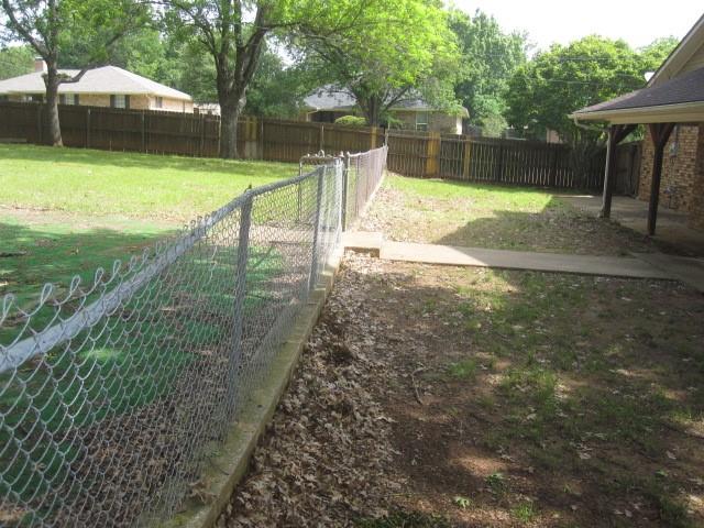 2801 Pyramid Circle Denison, TX 75020 - Photo 17 of 18 a view of a backyard with a garden