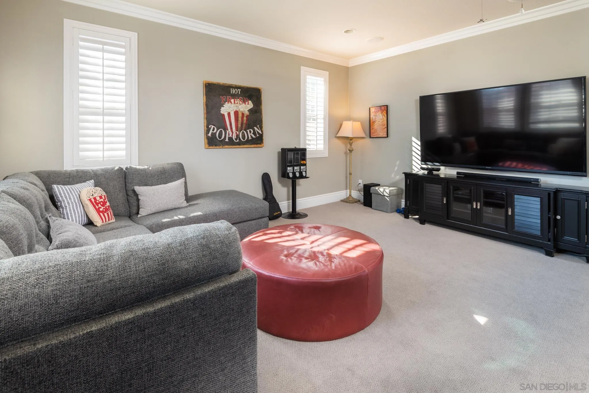 3234 Corte Aliso Carlsbad, CA 92009 - Photo 18 of 44 a living room with furniture and a flat screen tv