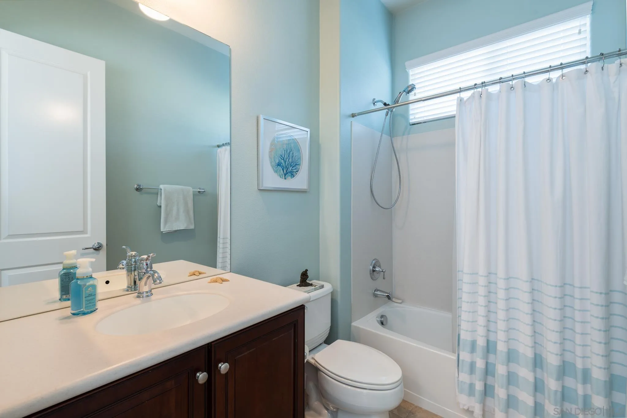 3234 Corte Aliso Carlsbad, CA 92009 - Photo 20 of 44 a bathroom with a granite countertop sink toilet and shower