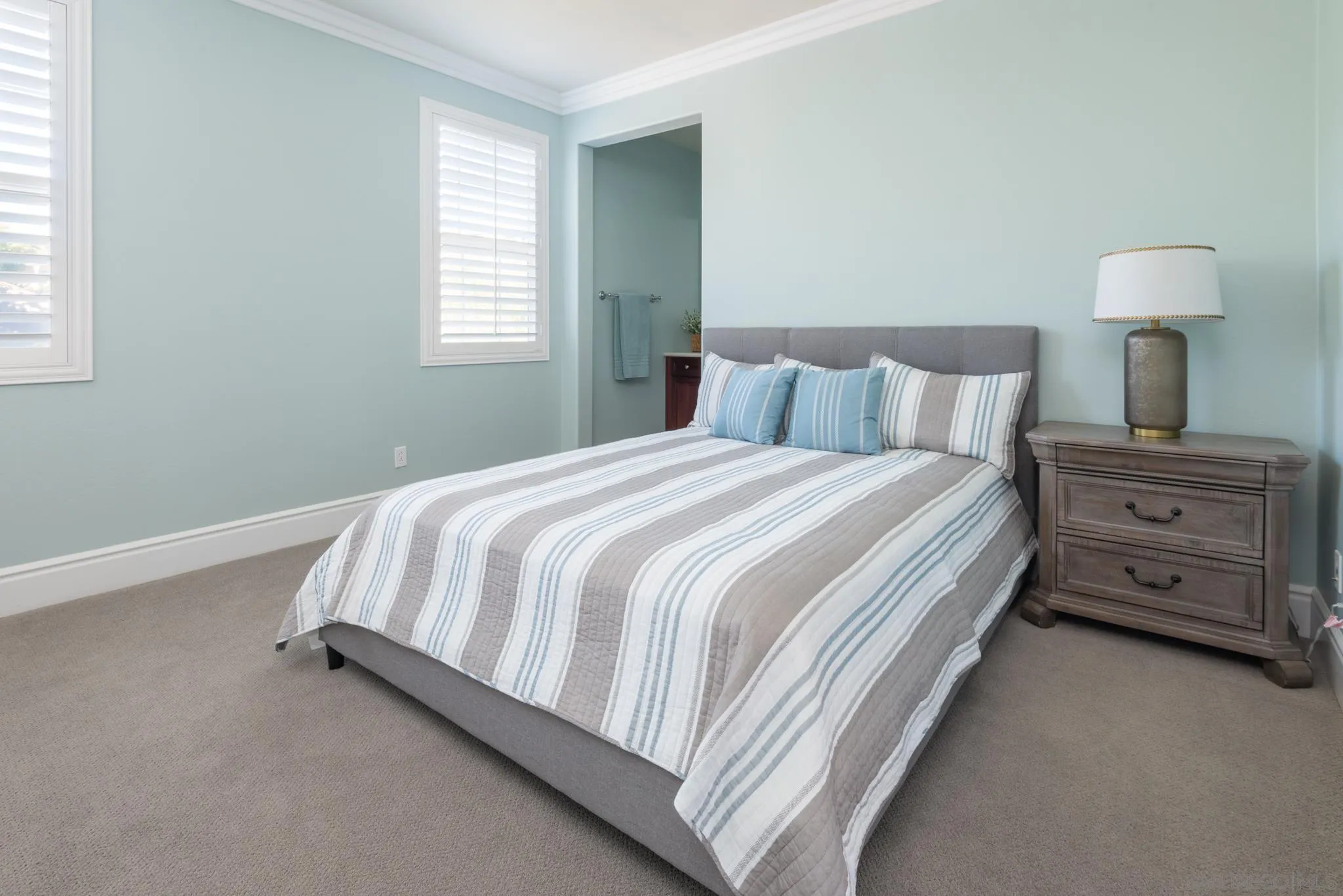 3234 Corte Aliso Carlsbad, CA 92009 - Photo 21 of 44 a bedroom with a bed and a window