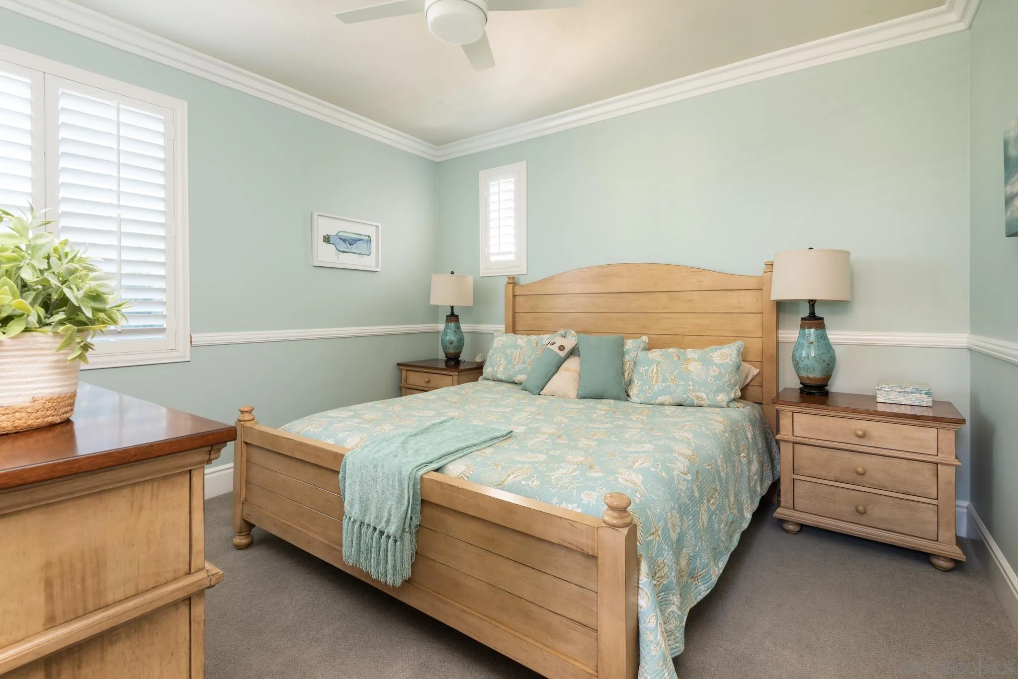 3234 Corte Aliso Carlsbad, CA 92009 - Photo 23 of 44 a bedroom with a bed and a table in it