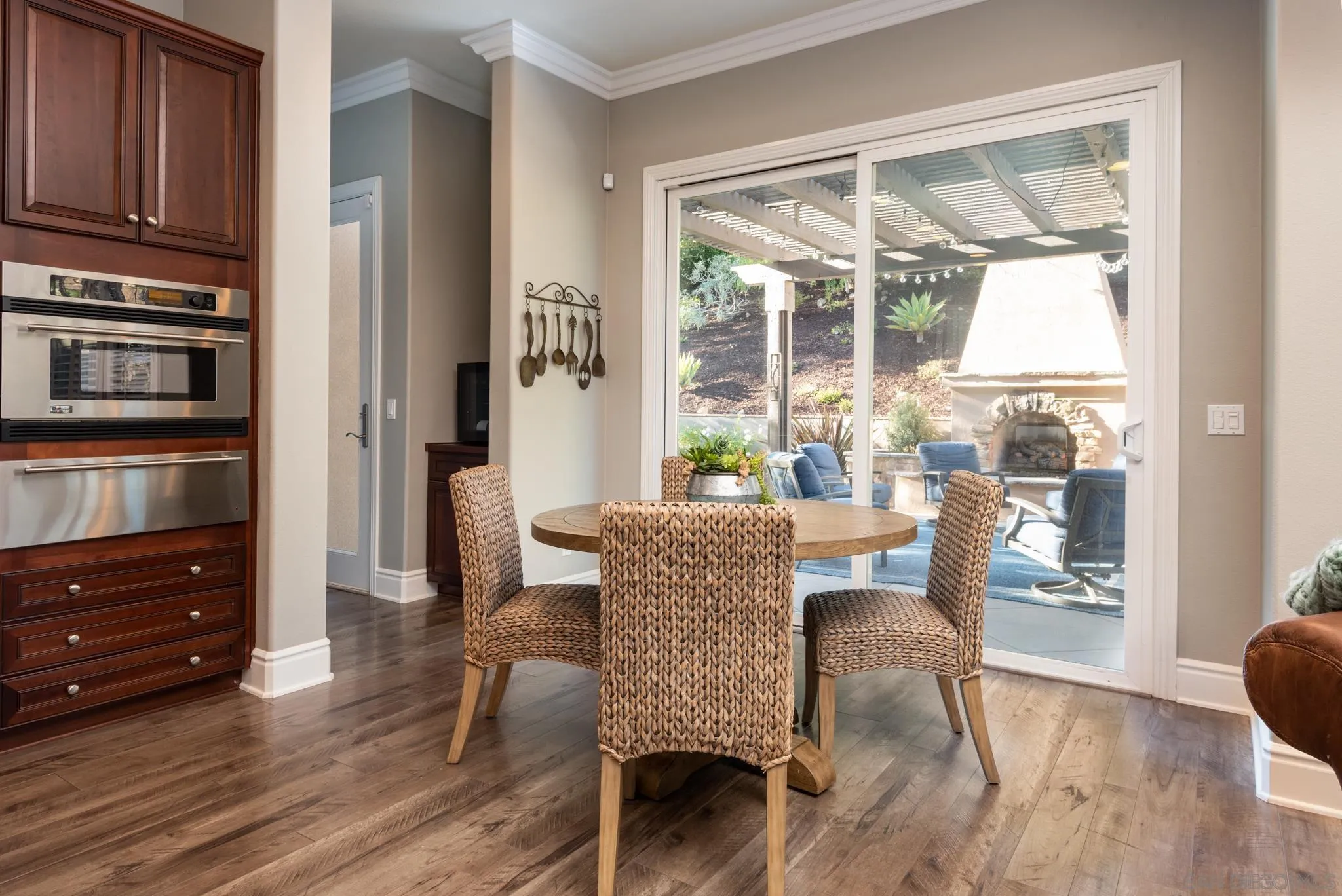 3234 Corte Aliso Carlsbad, CA 92009 - Photo 8 of 44 a dining room with furniture window wooden floor