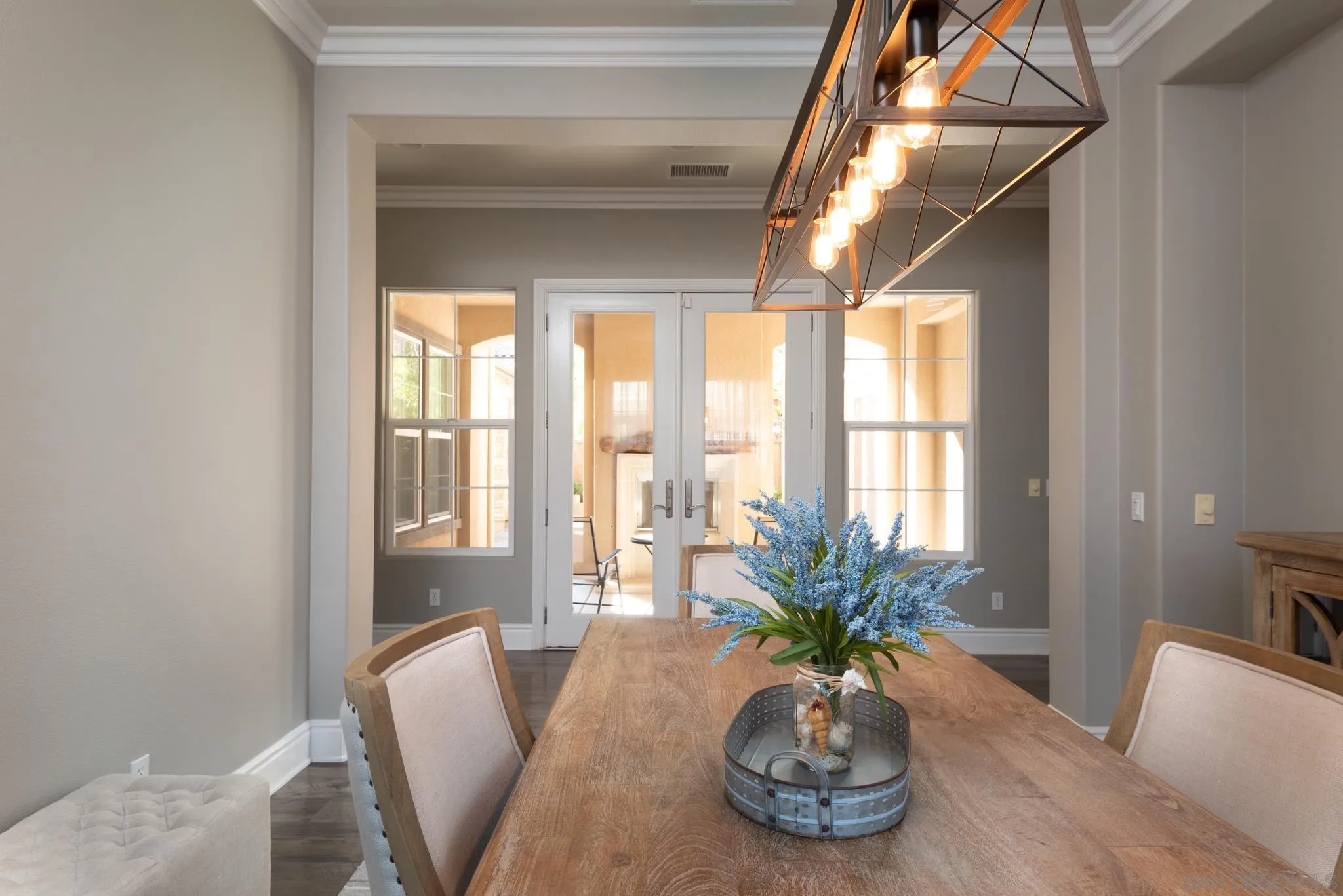 3234 Corte Aliso Carlsbad, CA 92009 - Photo 10 of 44 a view of a dining room with furniture window and wooden floor