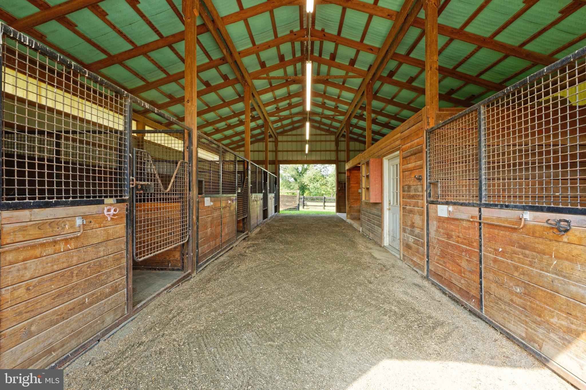 35075 Bloomfield Road Round Hill, VA 20141 - Photo 31 of 63 Wide center aisle in the 5-stall with tack room