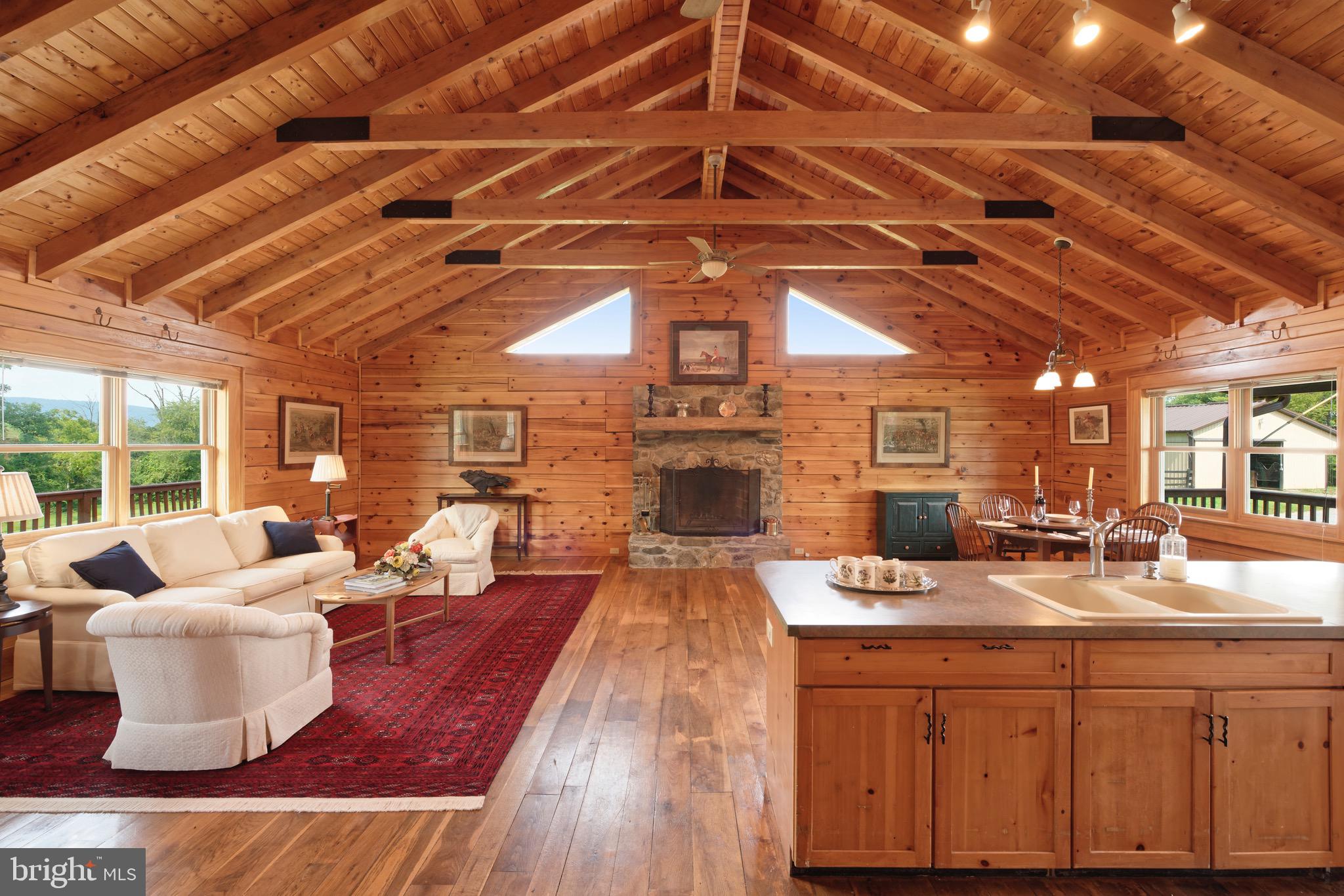 35075 Bloomfield Road Round Hill, VA 20141 - Photo 7 of 63 Anchoring the room is the large stone fireplace