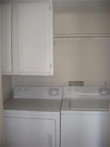a bathroom with a sink and cabinets