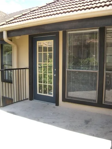 a view of outdoor space with sliding door and wooden floor