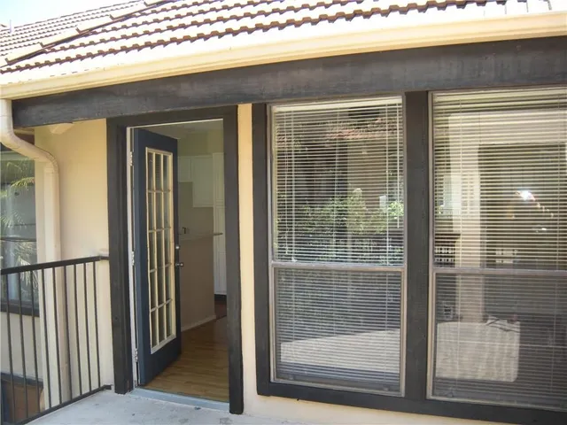 a view of a glass door with a balcony