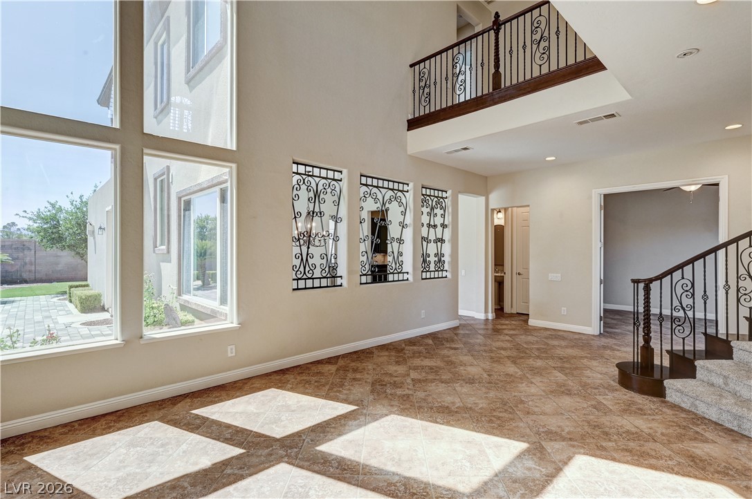 2793 Rosenhearty Drive Henderson, NV 89044 - Photo 23 of 85 This living space offers soaring ceilings and ample natural light, creating an airy and grand ambiance.