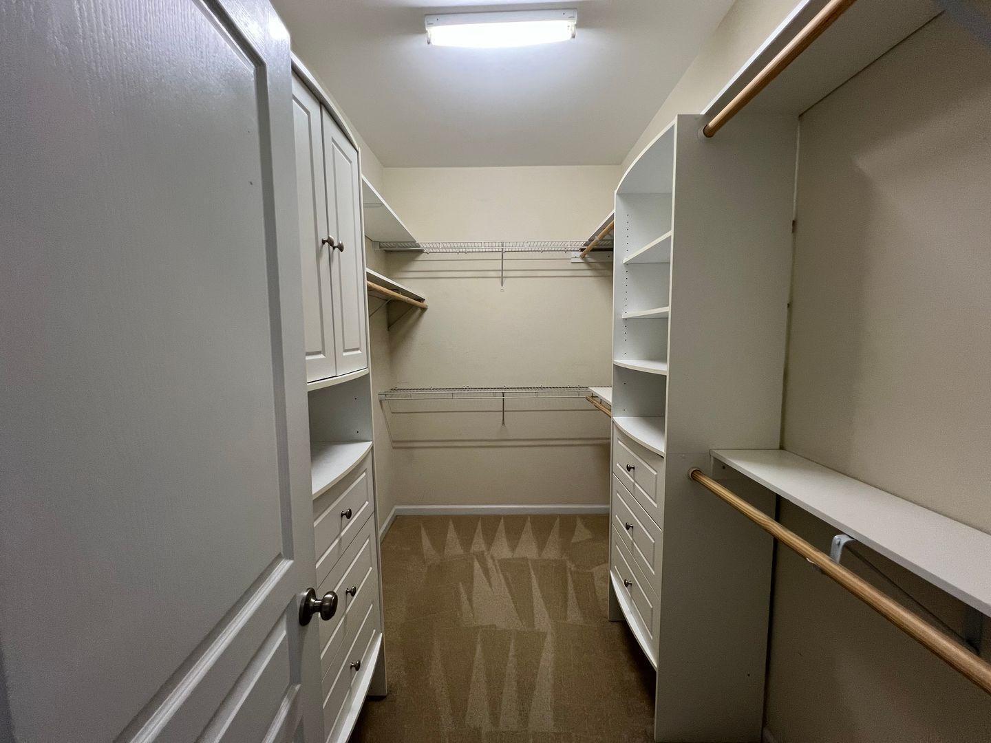 10117 Falls Meadow Court Raleigh, NC 27617 - Photo 18 of 34 a view of walk in closet