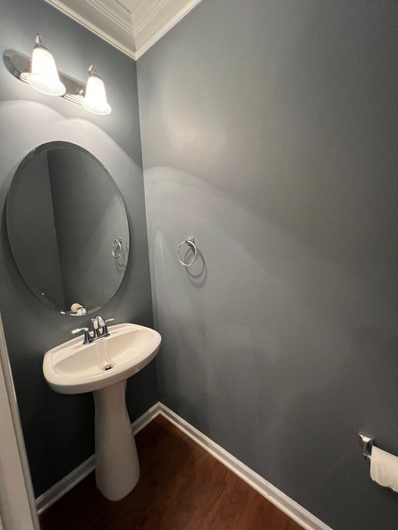 10117 Falls Meadow Court Raleigh, NC 27617 - Photo 24 of 34 a bathroom with a sink toilet and a mirror