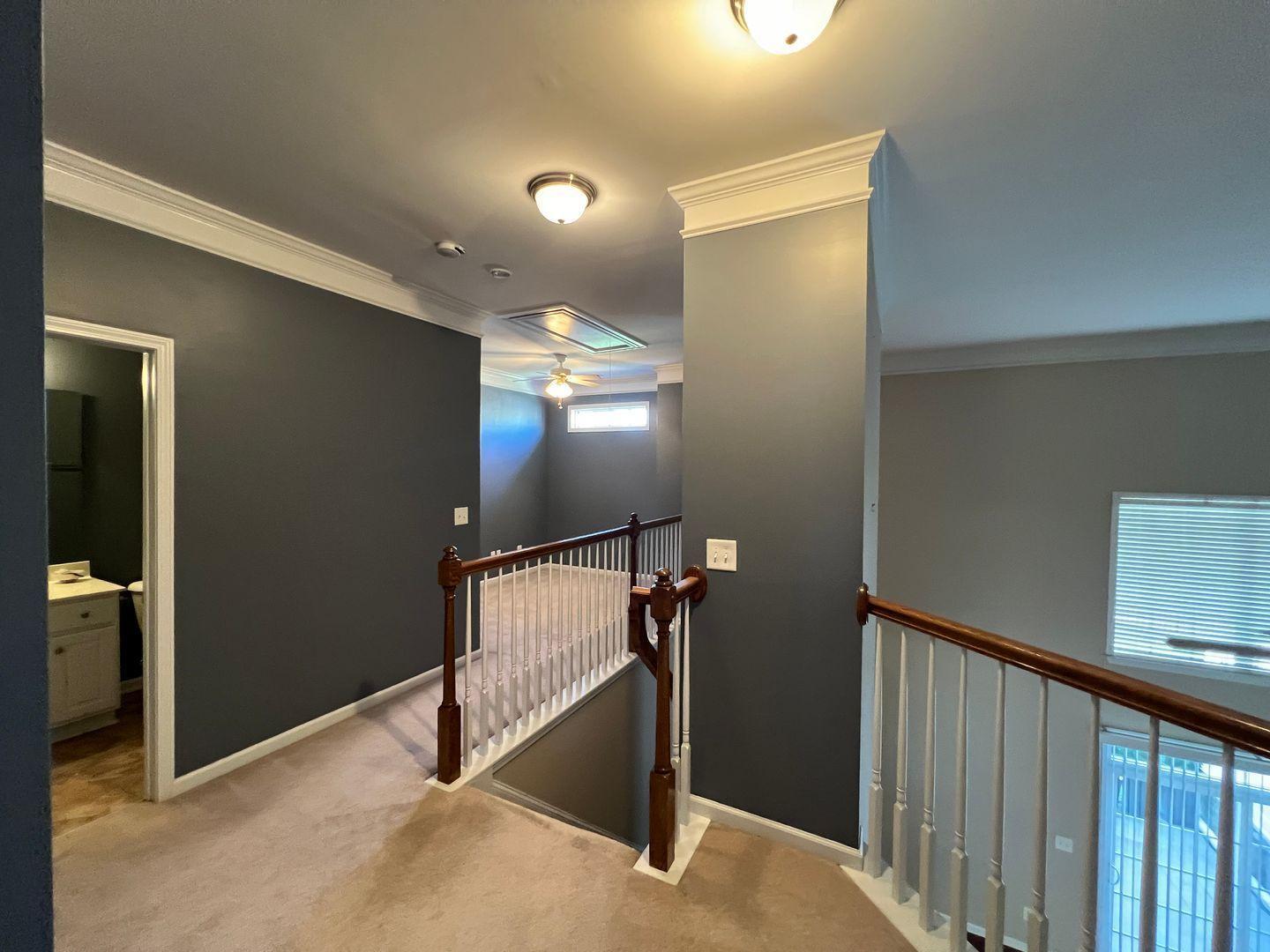 10117 Falls Meadow Court Raleigh, NC 27617 - Photo 25 of 34 a view of a hallway with workspace