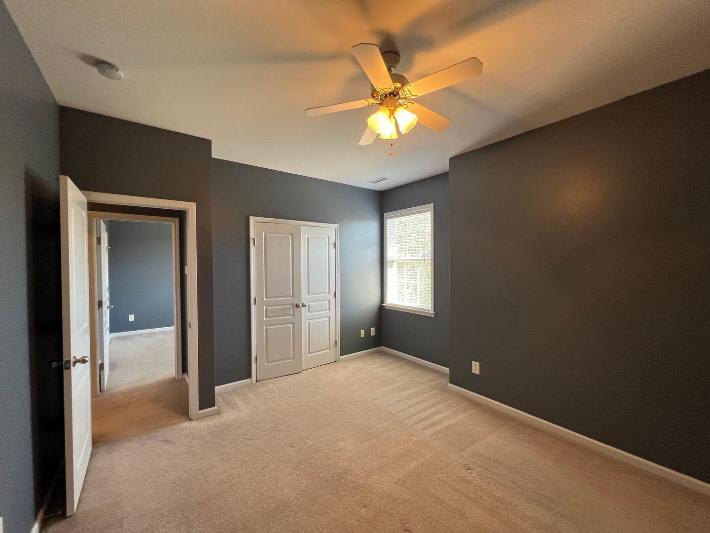 10117 Falls Meadow Court Raleigh, NC 27617 - Photo 27 of 34 a view of an empty room with a window