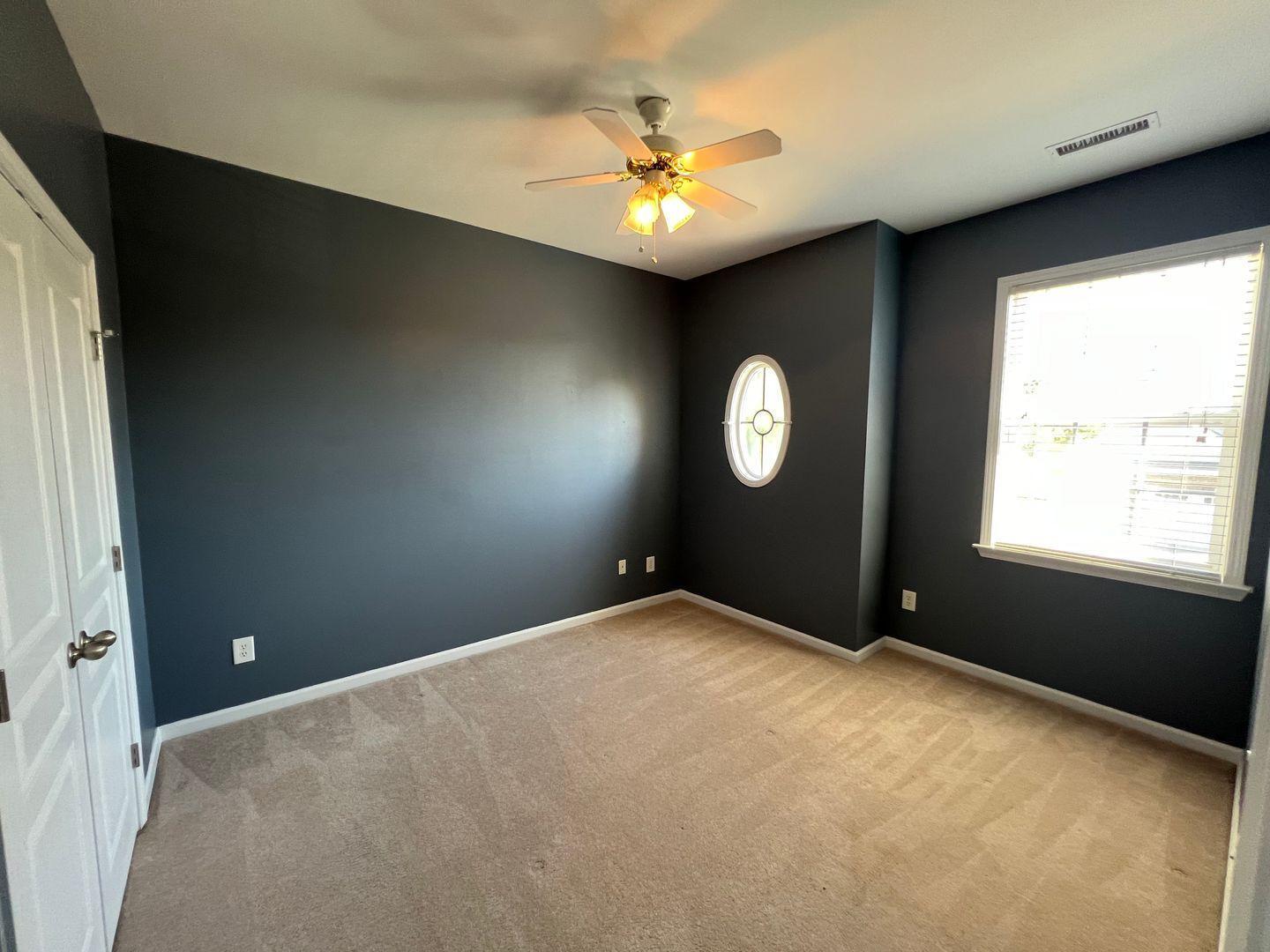 10117 Falls Meadow Court Raleigh, NC 27617 - Photo 28 of 34 a view of a livingroom with a ceiling fan and window