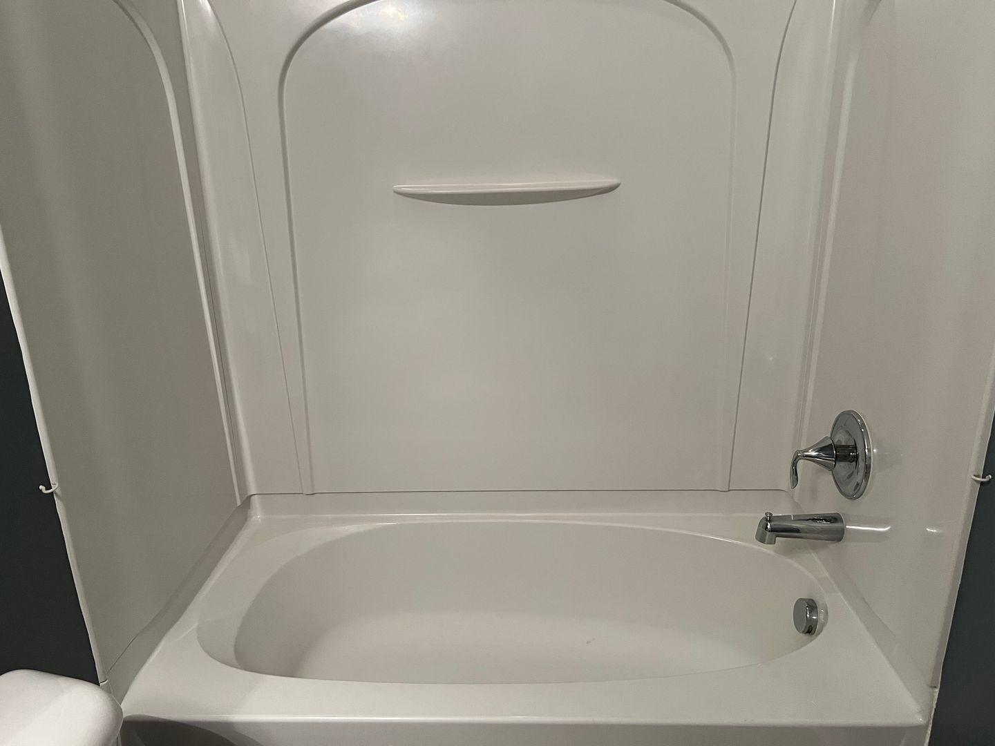 10117 Falls Meadow Court Raleigh, NC 27617 - Photo 30 of 34 a close view of a bathtub in bathroom