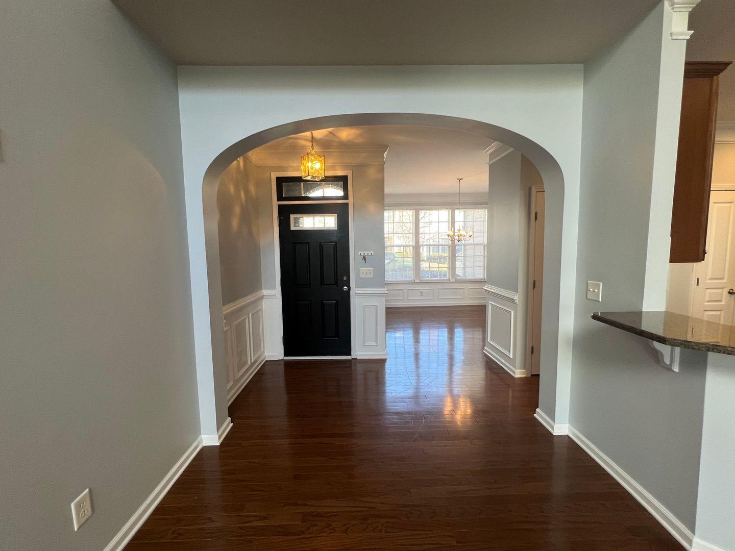 10117 Falls Meadow Court Raleigh, NC 27617 - Photo 6 of 34 a view of empty room with wooden floor