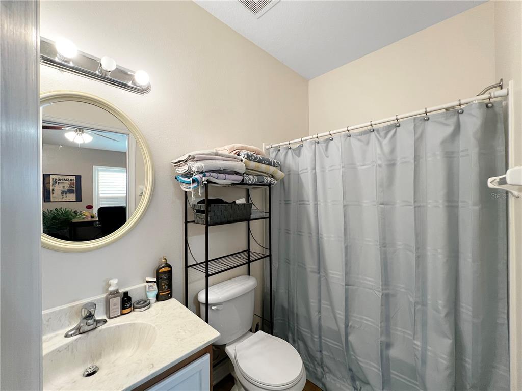 15767 Stable Run Drive Spring Hill, FL 34610 - Photo 29 of 34 a bathroom with a sink a toilet and mirror