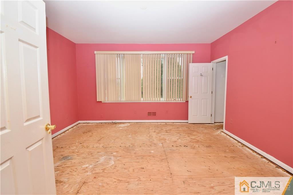 267 Summer Road Neshanic Station, NJ 08853 - Photo 12 of 25 an empty room with a window