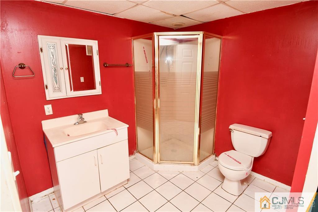 267 Summer Road Neshanic Station, NJ 08853 - Photo 15 of 25 a bathroom with a sink a toilet and mirror