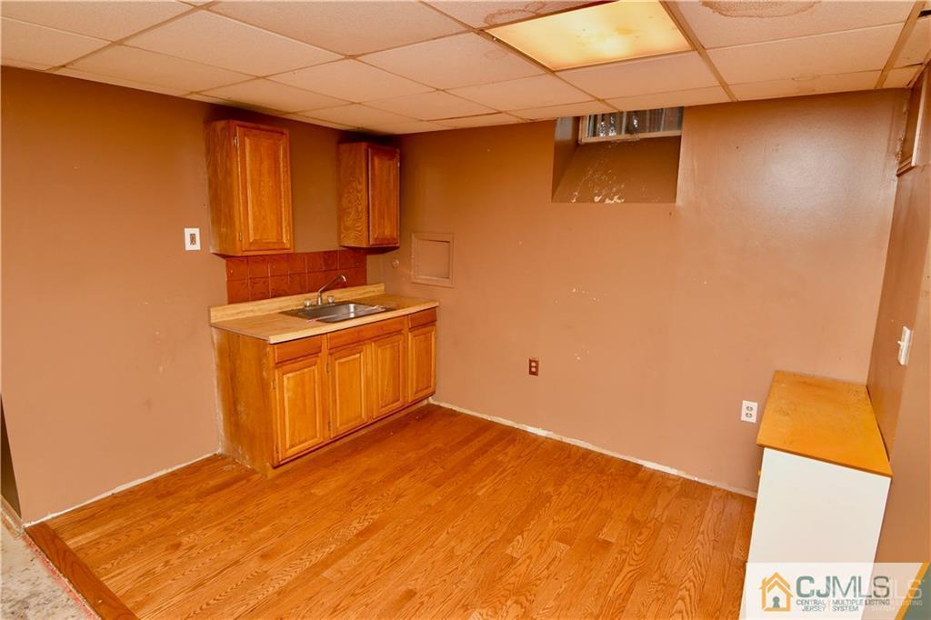 267 Summer Road Neshanic Station, NJ 08853 - Photo 16 of 25 a kitchen with a sink and a stove