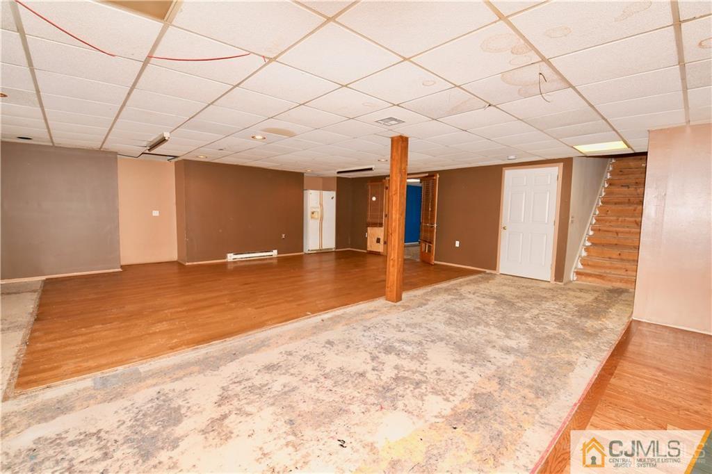 267 Summer Road Neshanic Station, NJ 08853 - Photo 20 of 25 a view of a livingroom with a staircase