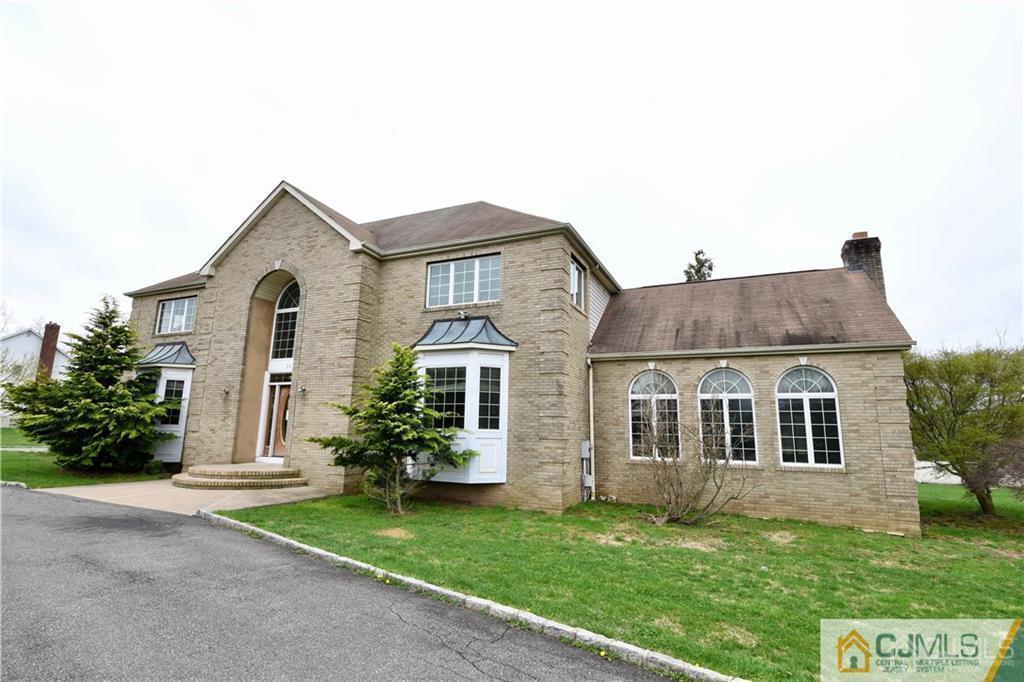 267 Summer Road Neshanic Station, NJ 08853 - Photo 2 of 25 a house that has a tree in front of the house