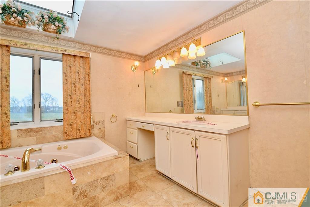 267 Summer Road Neshanic Station, NJ 08853 - Photo 21 of 25 a bathroom with a tub sink and mirror