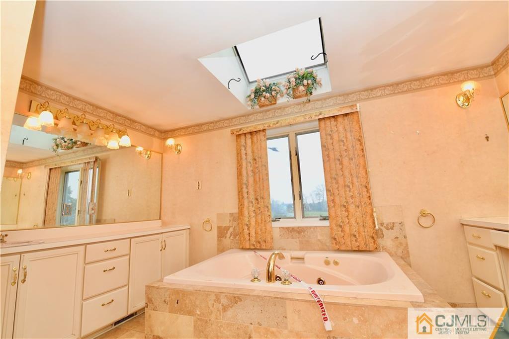 267 Summer Road Neshanic Station, NJ 08853 - Photo 22 of 25 a bathroom with a tub sink and mirror