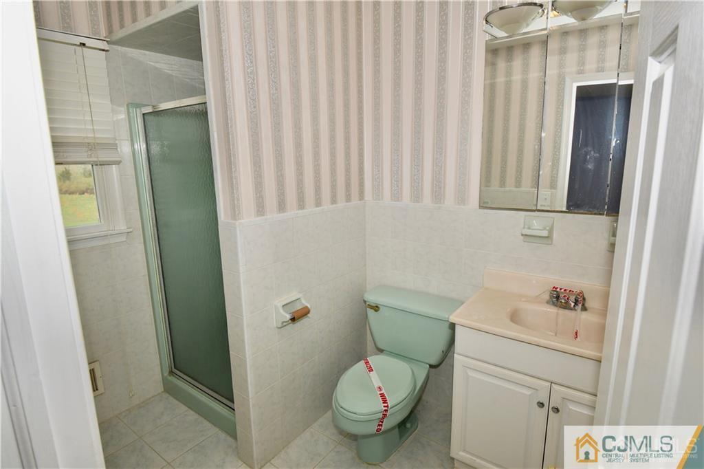 267 Summer Road Neshanic Station, NJ 08853 - Photo 23 of 25 a bathroom with a sink and toilet