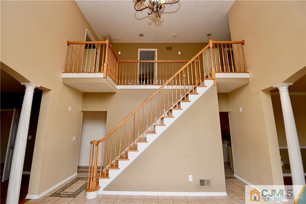 267 Summer Road Neshanic Station, NJ 08853 - Photo 4 of 25 a view of entryway and hall with wooden floor
