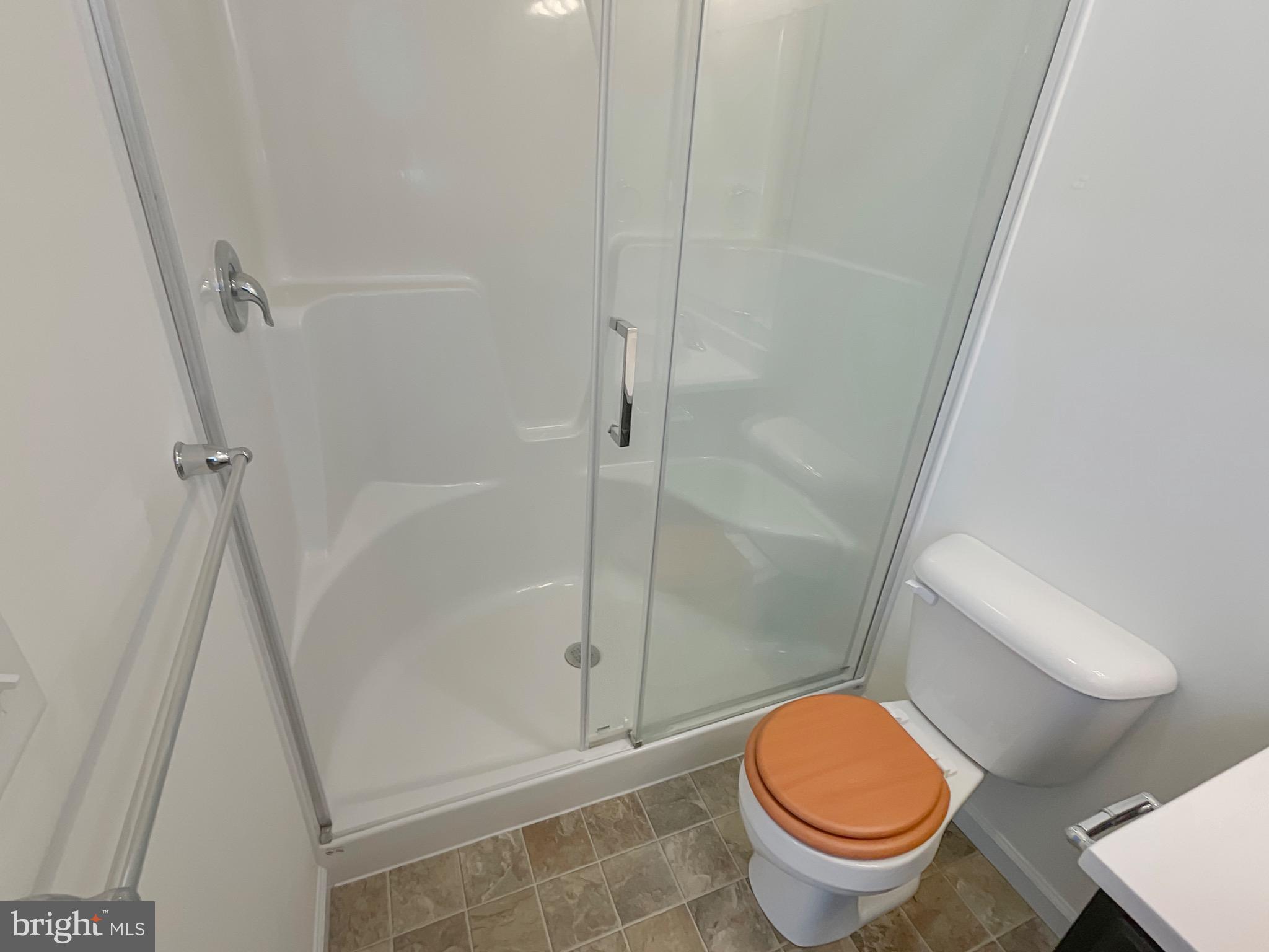 109 Holstein Drive Hanover, PA 17331 - Photo 18 of 26 a white toilet sitting next to a shower