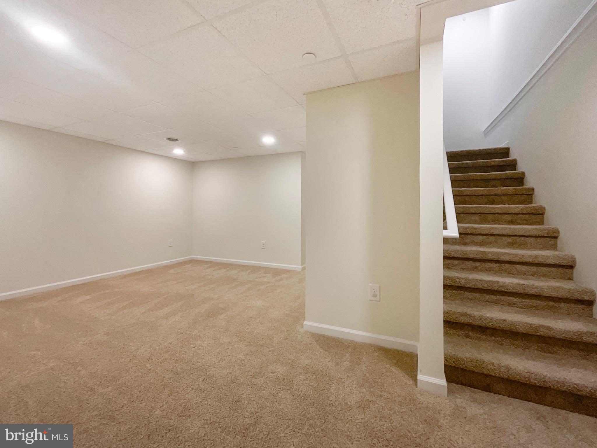 109 Holstein Drive Hanover, PA 17331 - Photo 19 of 26 a view of an empty room with stairs