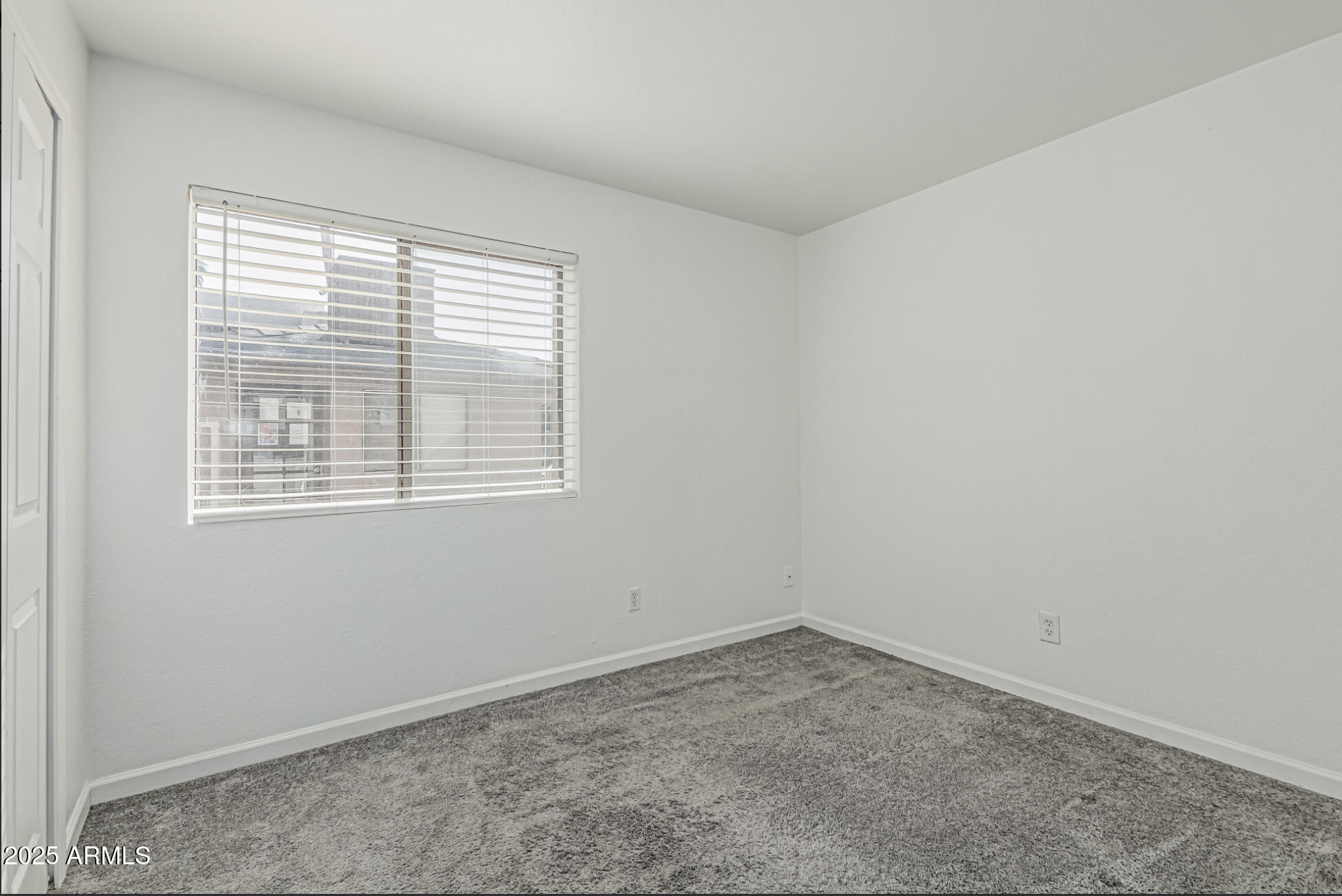 1065 West 1st Street, Unit 102 Tempe, AZ 85281 - Photo 11 of 24 an empty room with a window