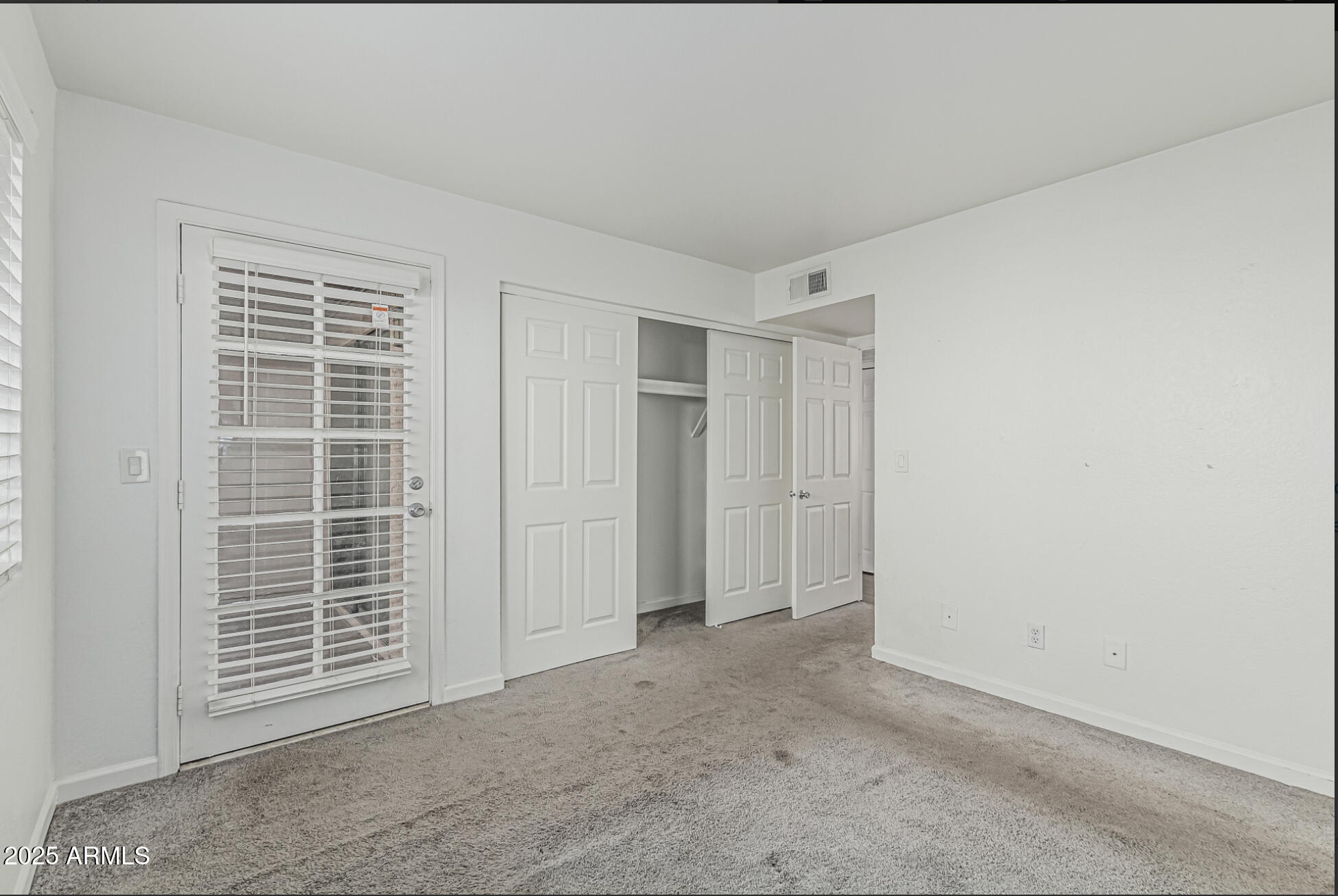 1065 West 1st Street, Unit 102 Tempe, AZ 85281 - Photo 15 of 24 a view of an empty room with a window