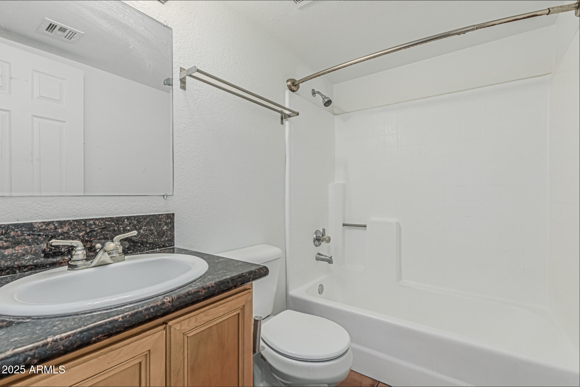 1065 West 1st Street, Unit 102 Tempe, AZ 85281 - Photo 17 of 24 a bathroom with a granite countertop sink toilet and shower